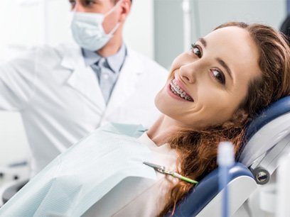 Patient with braces smiling during orthodontic appointment