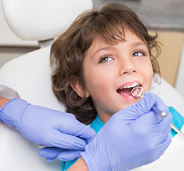 Child receiving dental exam