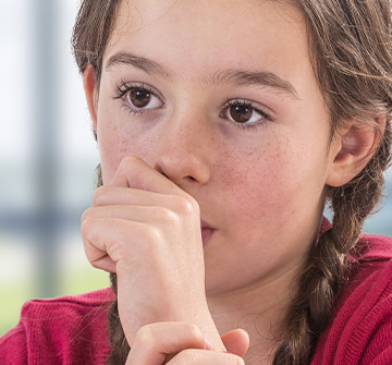 Young girl sucking her thumb