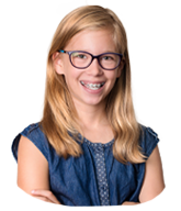 Teen girl with traditional braces smiling