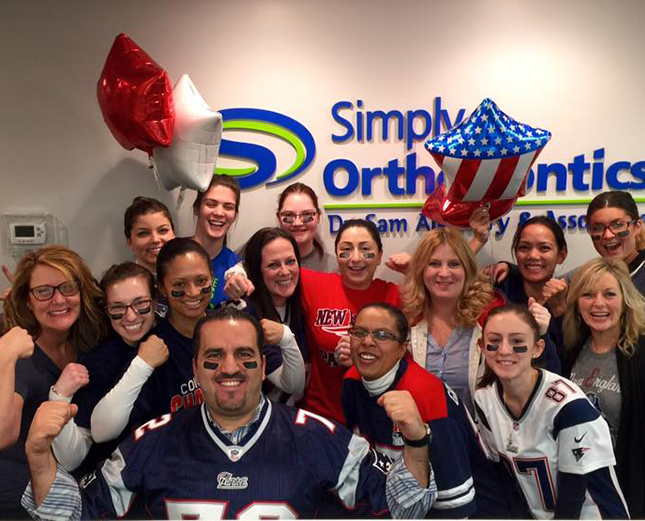 Team members wearing football jersies