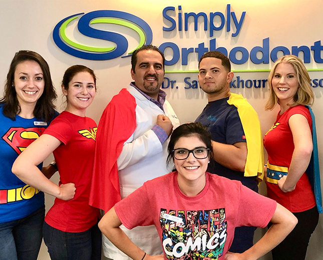 Team members dressed as super heroes