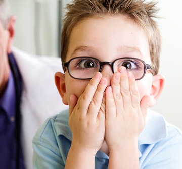 Shocked boy visiting his Randolph children’s emergency dentist 