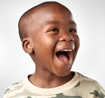 Boy smiling at his Randolph children’s emergency dentist