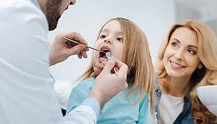 Dentist examining toddler