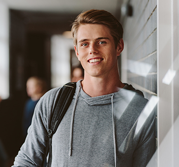 Teen smiling after root canal therapy