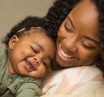 a closeup of an infant smiling