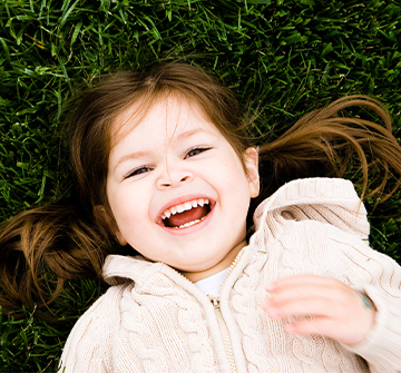 Little girl smiling after tooth-colored filling