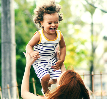 Toddler laughing after pulp therapy