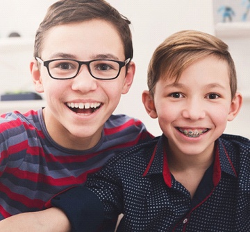 Smiling boys with tooth-colored fillings for kids in Randolph