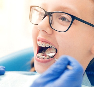 Young patient visiting their Randolph orthodontist for checkup