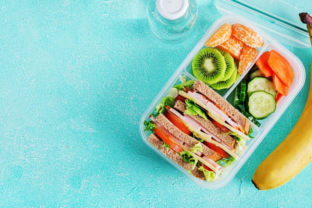 Aerial view of school lunch next to water bottle