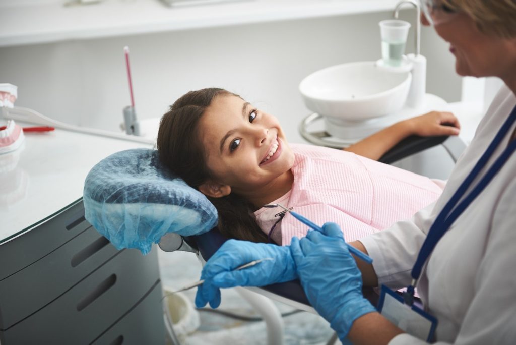 Closeup of child smiling at dental checkup