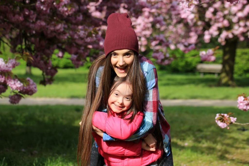 Mom and child with special needs smiling