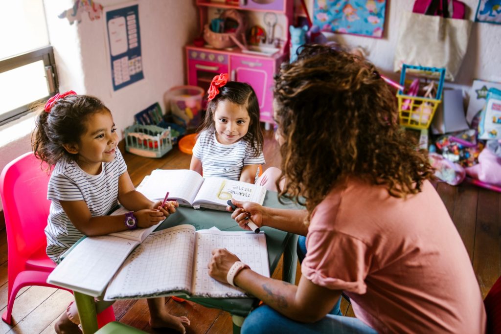 Parent homeschooling two daughters